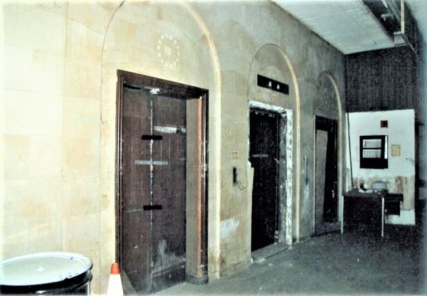 Before: view of lobby elevators before rehabilitation